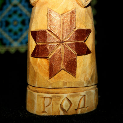 Detailed carving of Alatyr symbol on Rod wooden idol