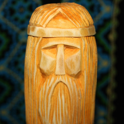 Close-up of Rod Slavic God face hand carved wooden idol