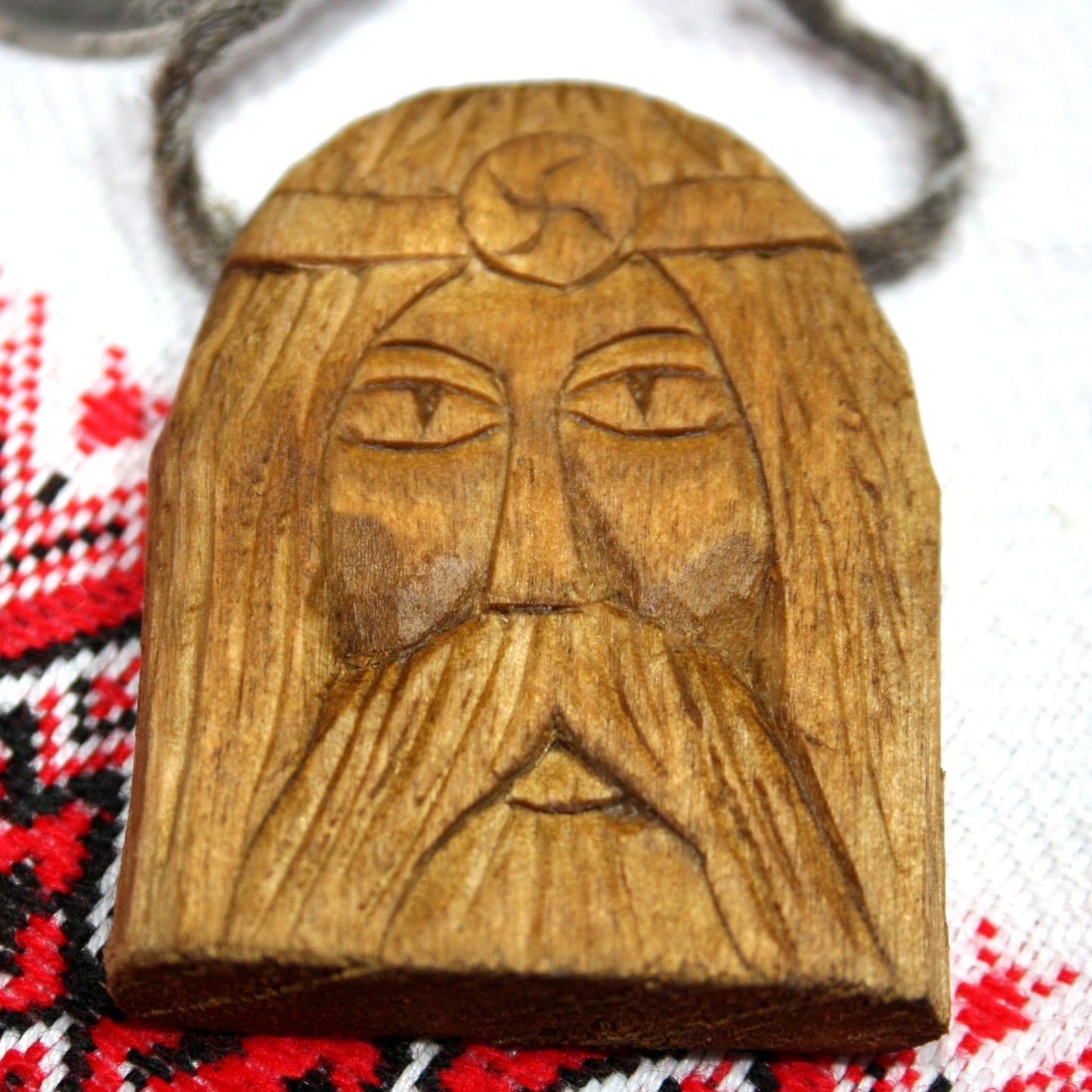 Front view of handmade Rod wooden pendant