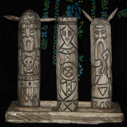 Hand carved Slavic dark gods set featuring Morana Veles and Chernobog wooden idols