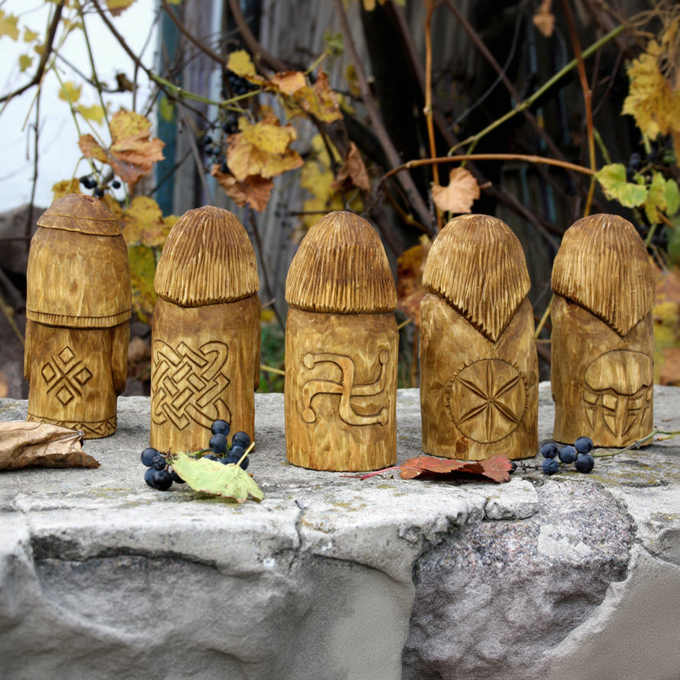 Back view of Slavic gods wooden figurine set hand carved from linden wood