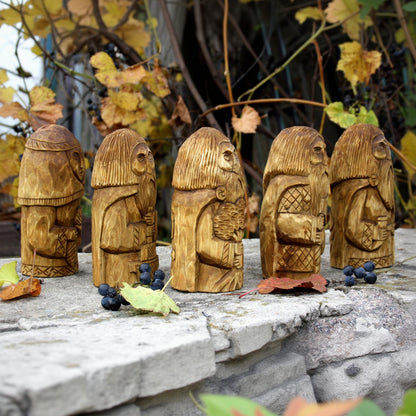 Side view of Perun Veles Svarog Rod and Makosh wooden figurines