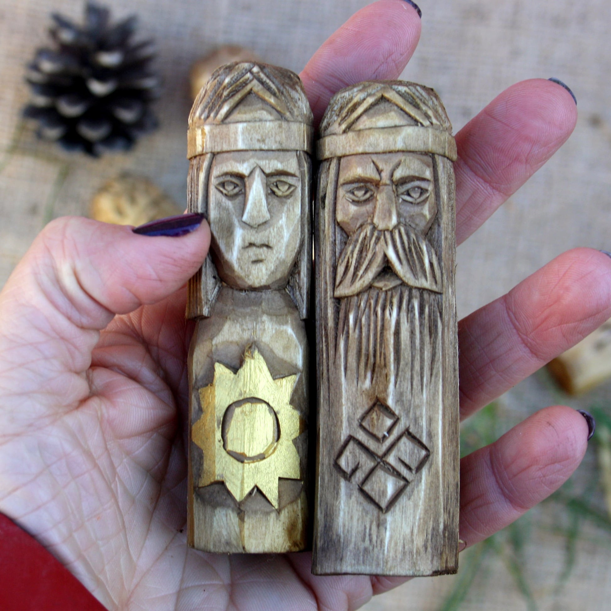 Small Slavic wooden idol 10 cm held in hand to show size and scale