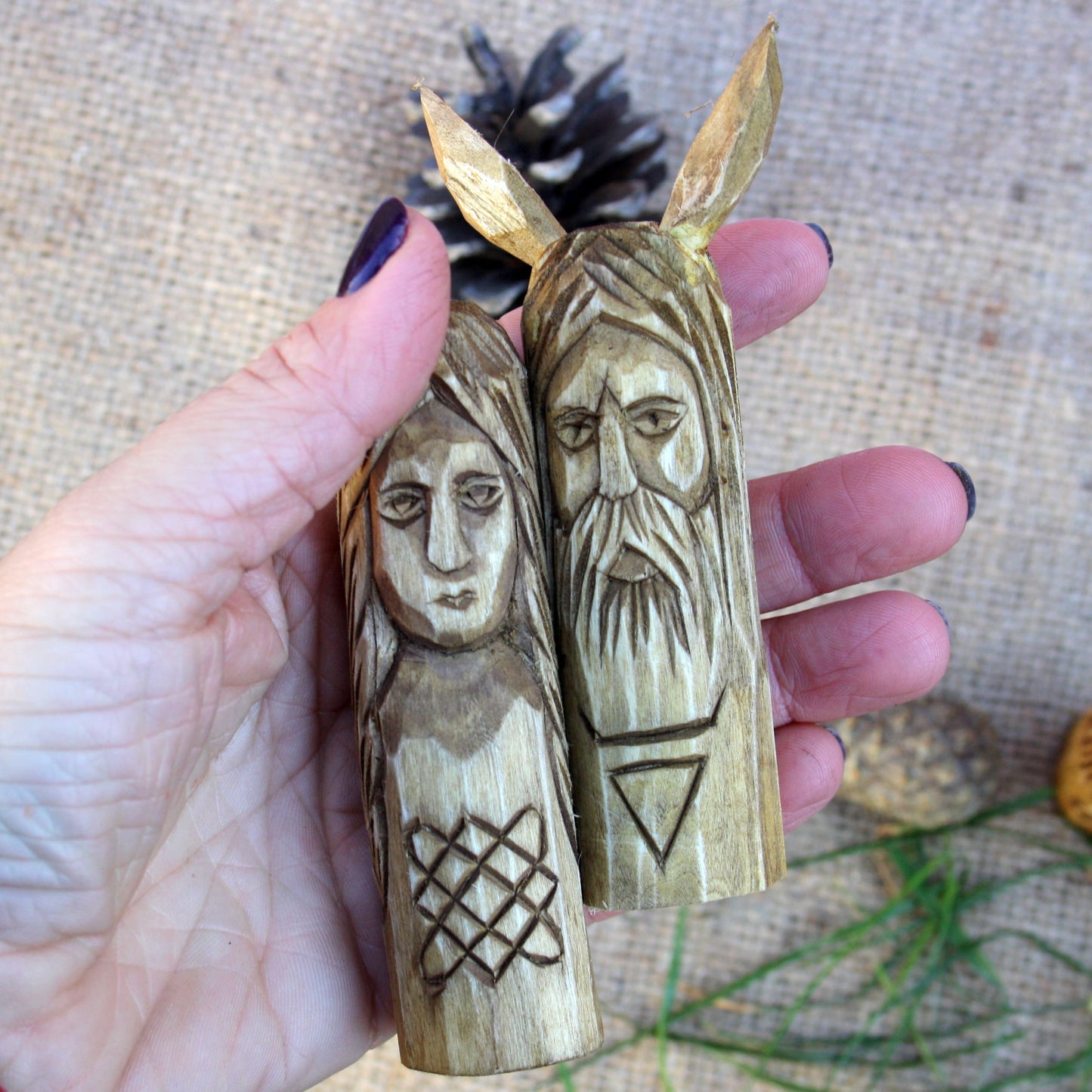Small Slavic wooden idol 10 cm held in hand to show size and scale