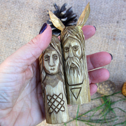 Small Slavic wooden idol 10 cm held in hand to show size and scale
