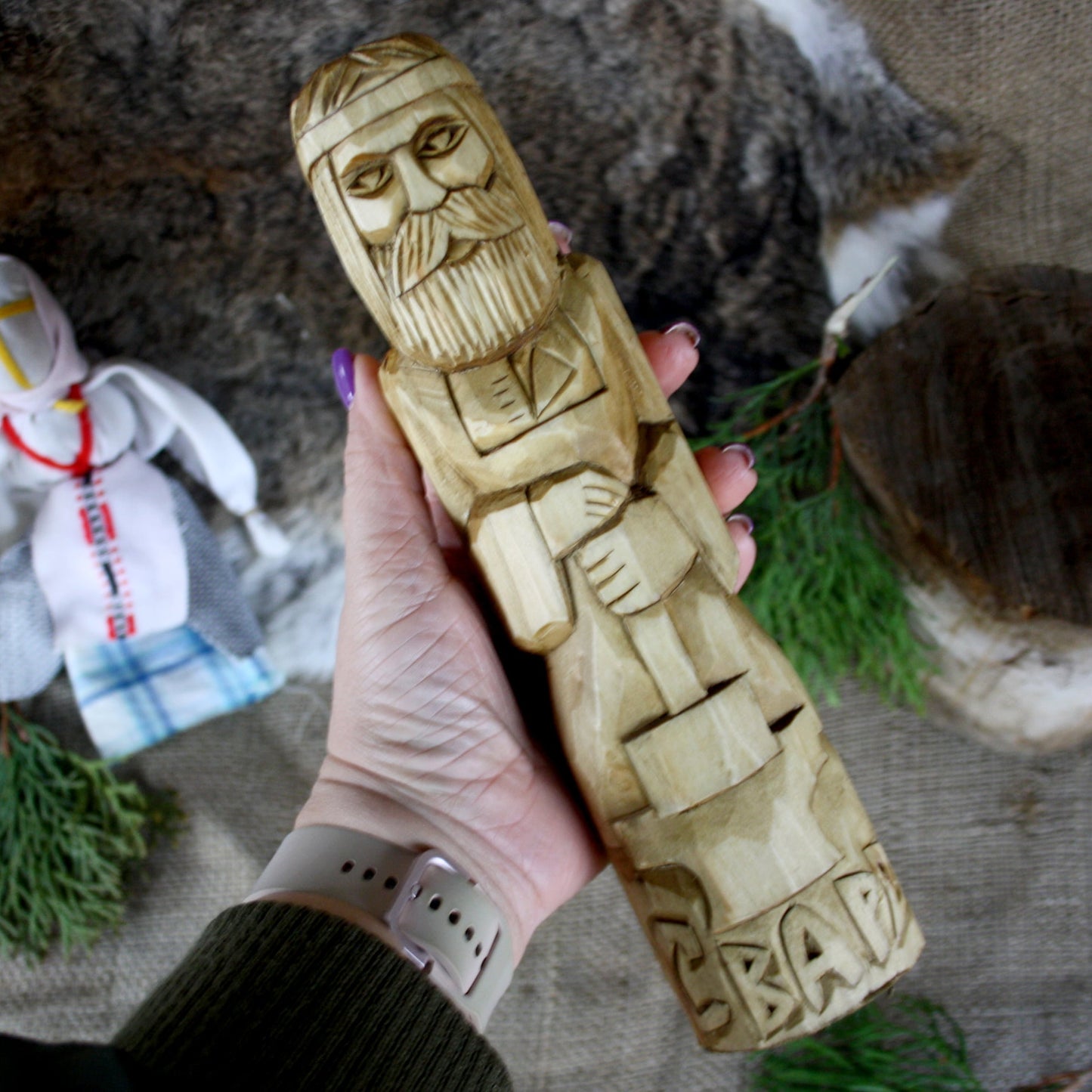 Svarog Slavic God wooden statue held in hand for size comparison