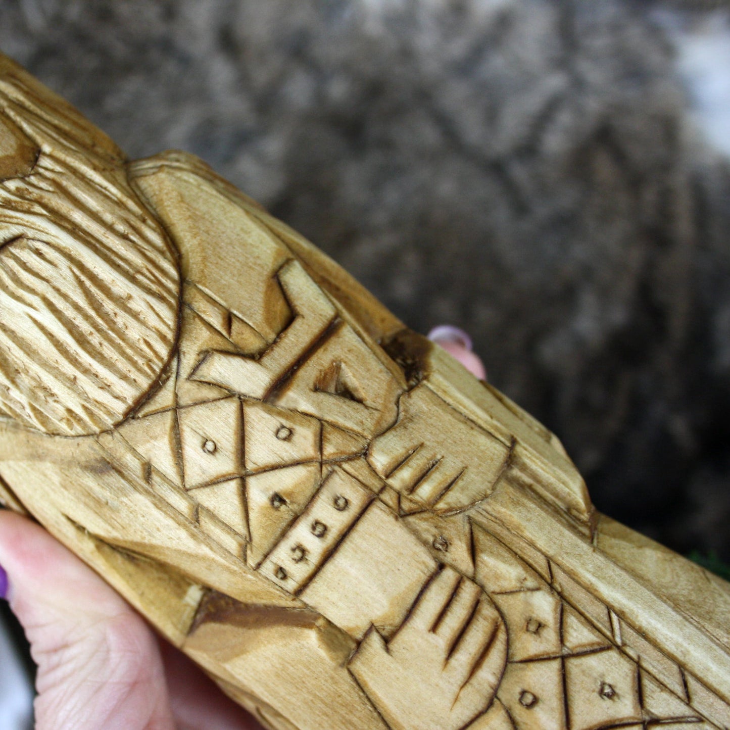 Detailed carving of Veles Slavic God wooden statue