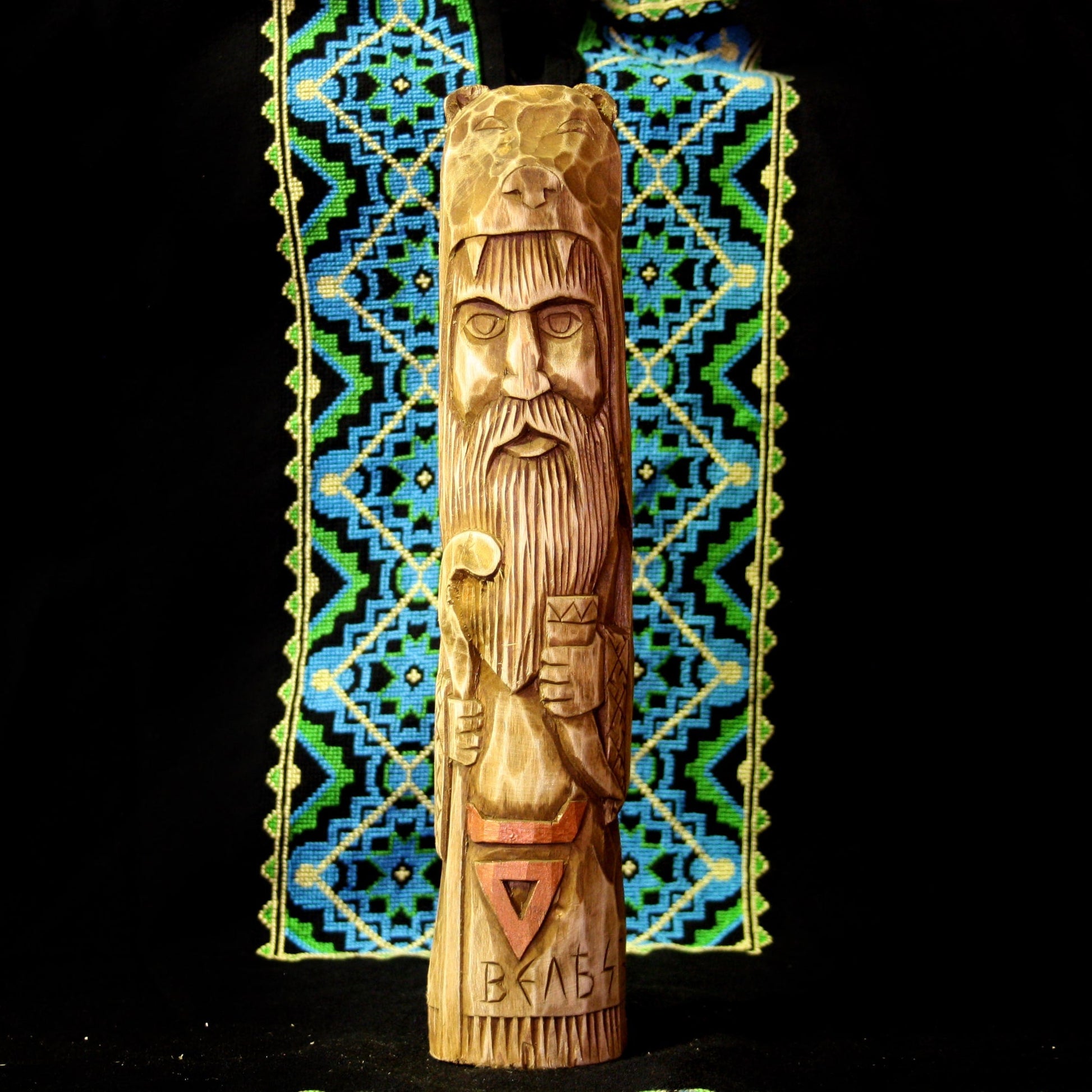 Front view of Veles Slavic God wooden idol 28.5 cm hand carved from linden wood