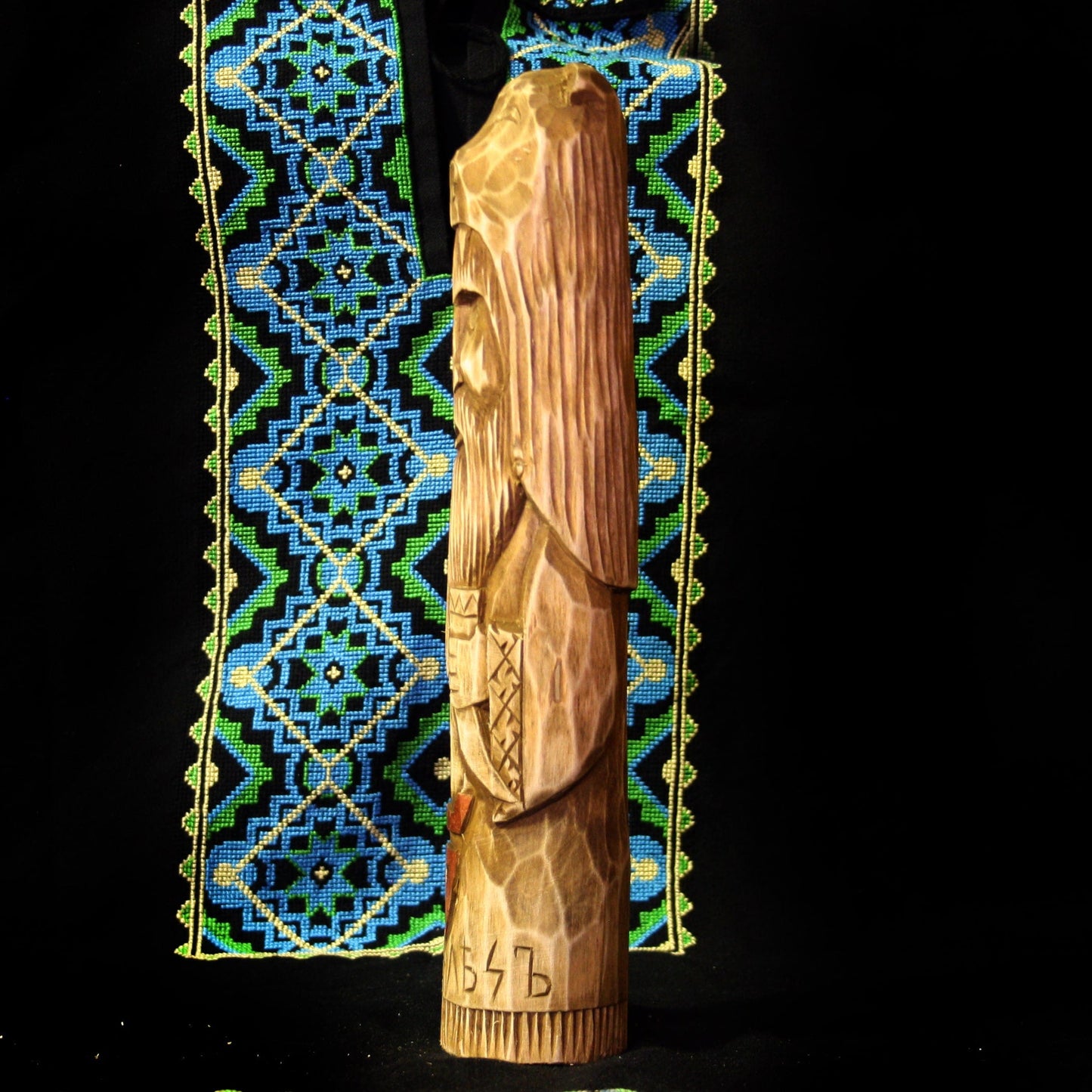 Left side of Veles Slavic God wooden idol handcrafted from linden wood
