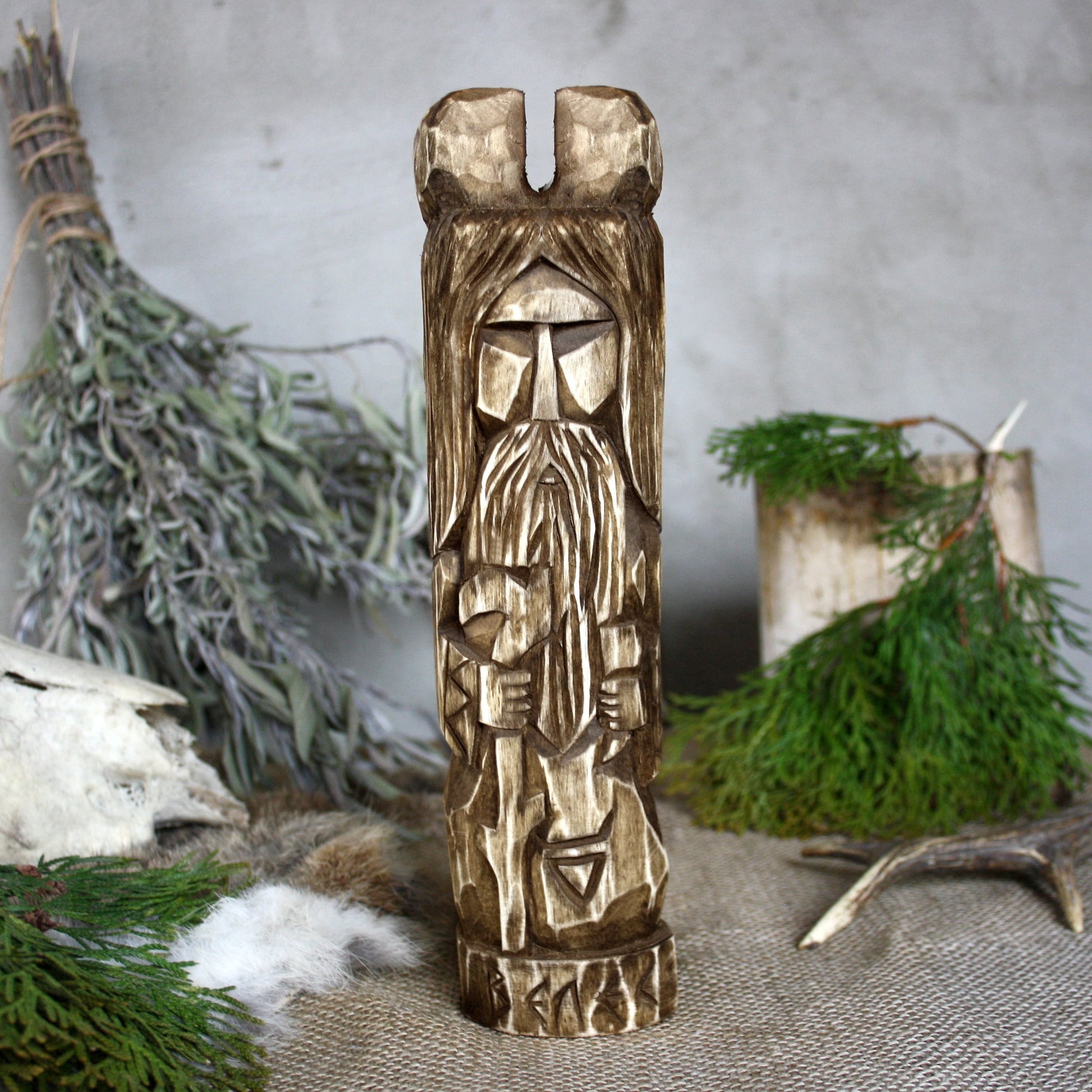 Front view of Veles Slavic wooden idol 25 cm with dark wood finish