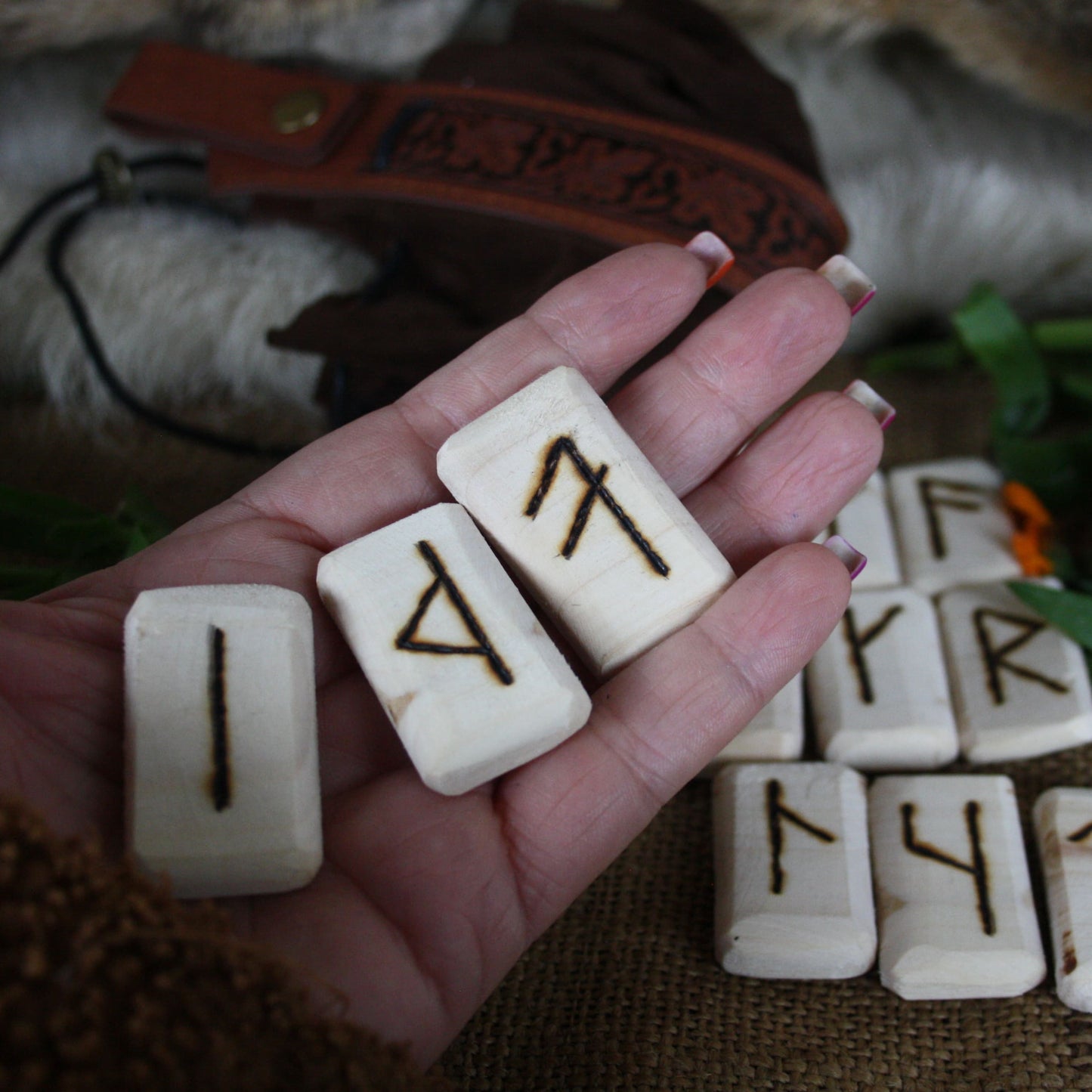 Close-up of handcrafted Slavic runes burned into natural linden wood