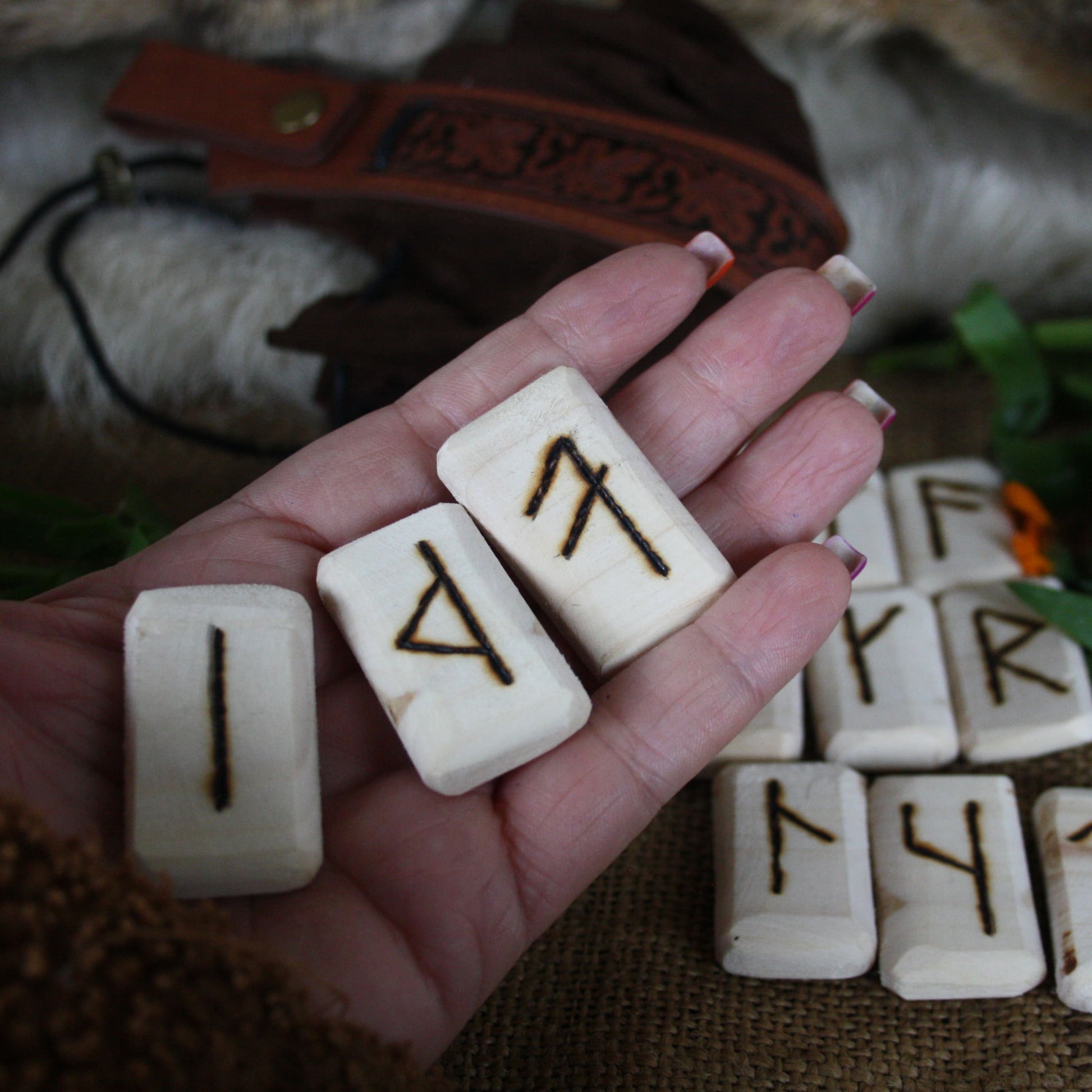 Close-up of handcrafted Slavic runes burned into natural linden wood